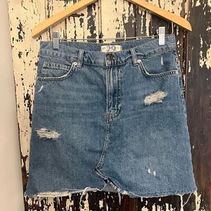 Free People We The People Distressed Denim jean skirt. Women’s size 29.
